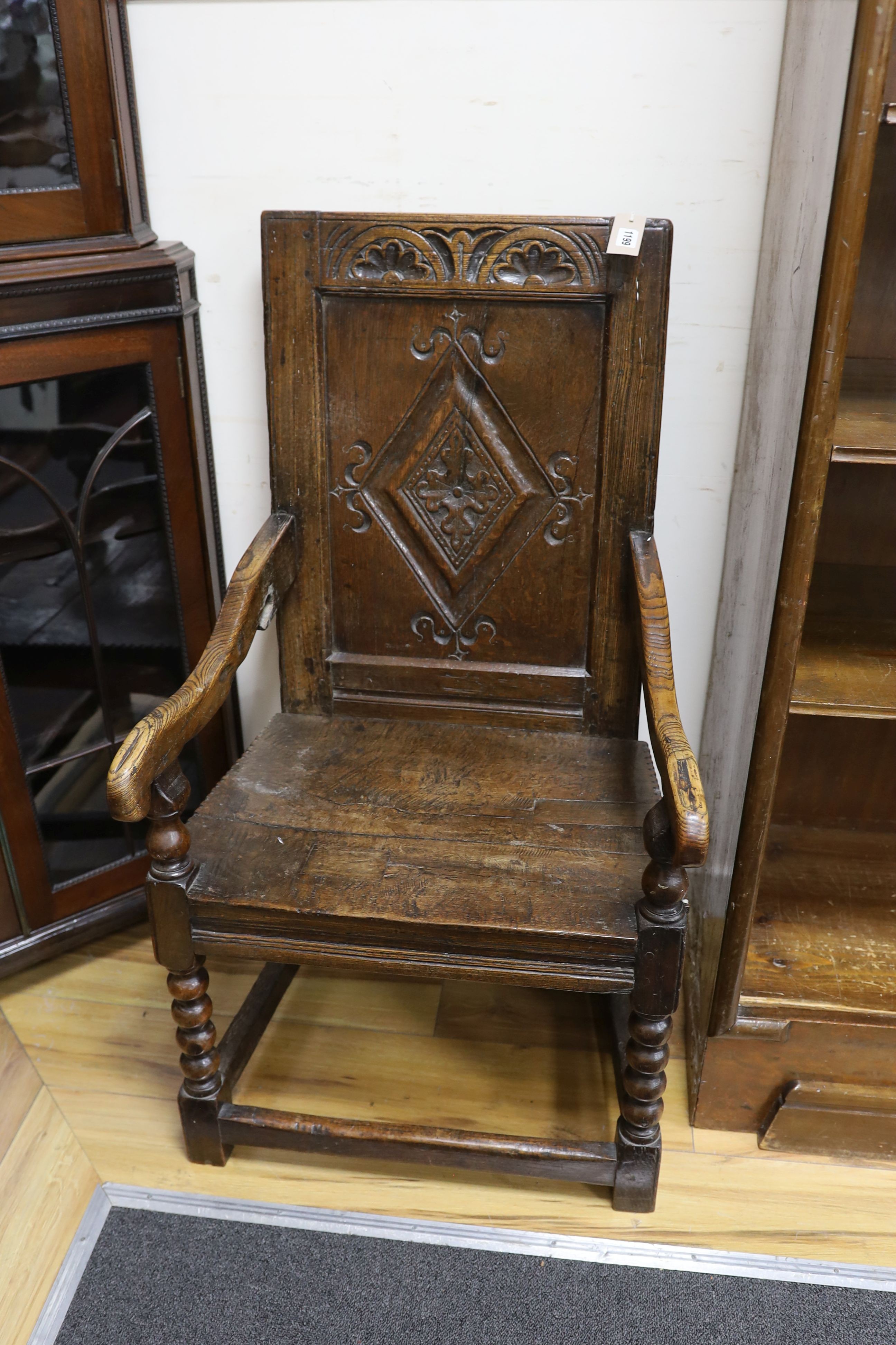 A late 17th century and later Halifax oak panel back armchair, width 52cm, depth 44cm, height 98cm